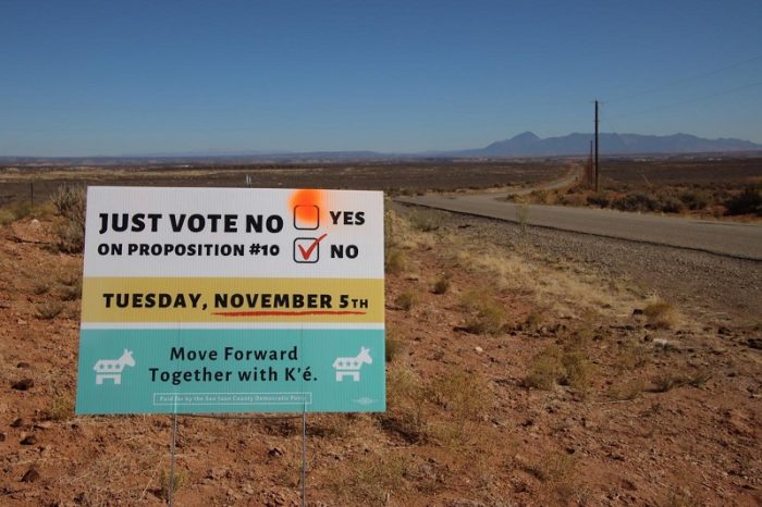 A yard sign-style campaign message of the San Juan County Democratic Party on Highway 262 just inside the Aneth extension of the Navajo Nation was modified in advance of a special election on Nov. 5. The signs were positioned along highways in the southern part of the county. (Bill Keshlear)