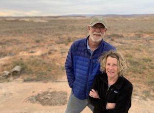 Bluff Mayor Ann Leppanen and Bluff Town Councilman Brant Murray stand where a solar farm might sprout photovoltaic panels on the Bluff Bench just north of town. They say the proposal would mar the view of land designated by President Obama as Bears Ears National Monument in 2016. The acreage is no longer within boundaries of the current monument. (KUER)