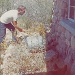 Ed live-captures rattler. Why would anyone want to kill a rattler at his front door? Photo by the author. Tuscon, 1971