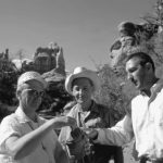 Senator Frank Moss, Superintendent Bates Wilson, and Secretary of the Interior Stewart Udall in the Maze area sharing water and planning for Canyonlands’ expansion, August 1968. Congress added the Maze District to Canyonlands in 1971.