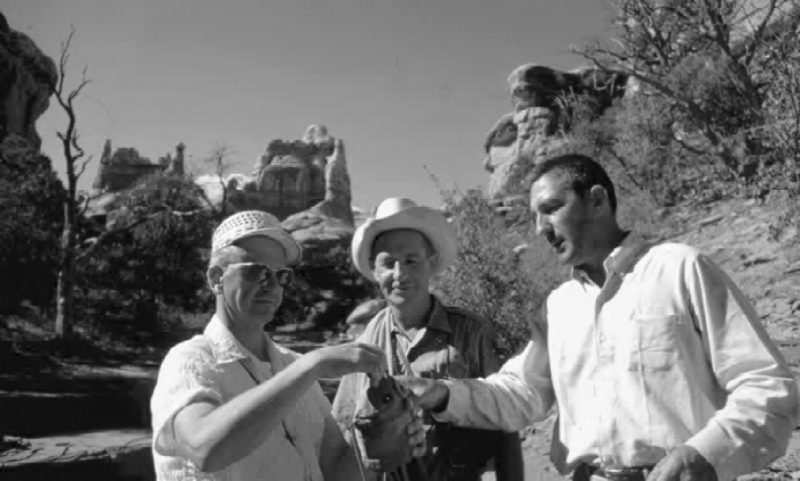 Senator Frank Moss, Superintendent Bates Wilson, and Secretary of the Interior Stewart Udall in the Maze area sharing water and planning for Canyonlands’ expansion, August 1968. Congress added the Maze District to Canyonlands in 1971.