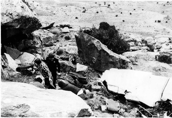 Grand County deputies Roy Daughetee (left) and Doug Squire (right) examine the wreckage. This photo was also borrowed from the Sheriff's Office