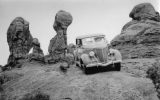 Harry Goulding, founder of Goulding's Trading Post in Monument Valley, driving at Arches in the early 40s. Photo by Harry Reed.