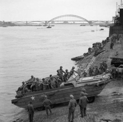 DUKW in action during WWII crossing river in Europe w/American troops, Sept, 1944