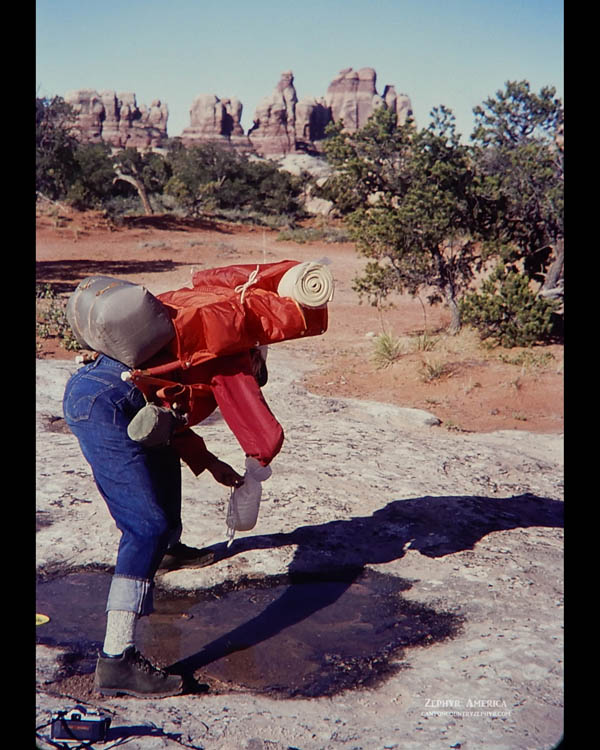 Gathering water "spoonful by spoonful" in Chesler Park. The Needles District of Canyonlands. JULY 1972. Photo by Edna Fridley