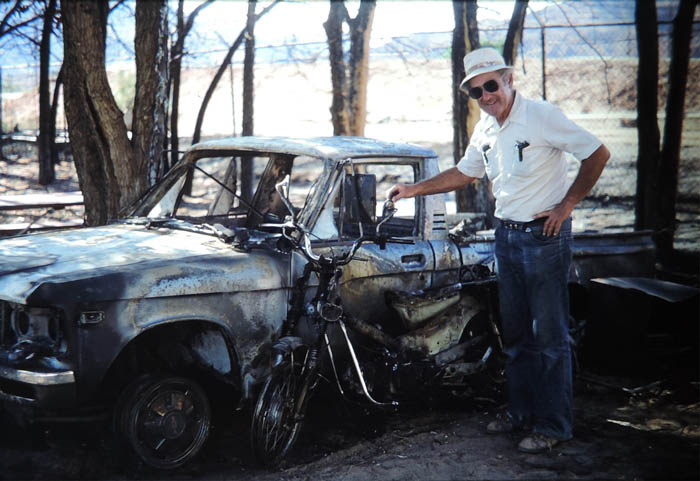 Reuben next to the incinerated Honda.