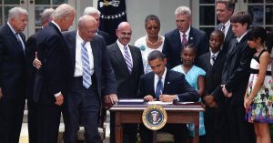 President Obama signing the 2009 Family Smoking Prevention and Tobacco Control Act