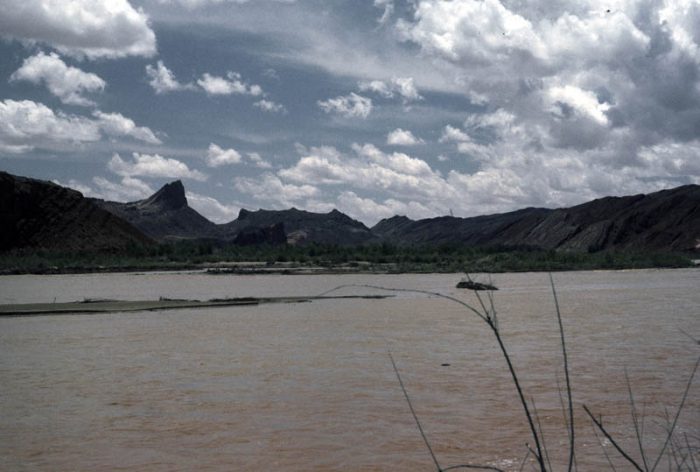 Figure 2. Mule Ear diatreme as first seen from river level at RM 133.5, one-half mile downstream from the mouth of Comb Wash. (G.M. Stevenson photo) 