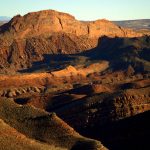 Figure 4. tilted rocky terrain lying between Mule Ear and San Juan River. (JR Lancaster photo)