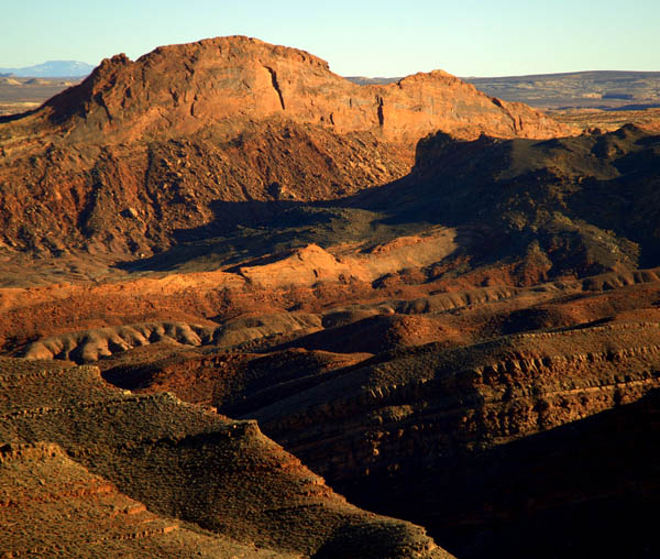 Figure 4. tilted rocky terrain lying between Mule Ear and San Juan River. (JR Lancaster photo)