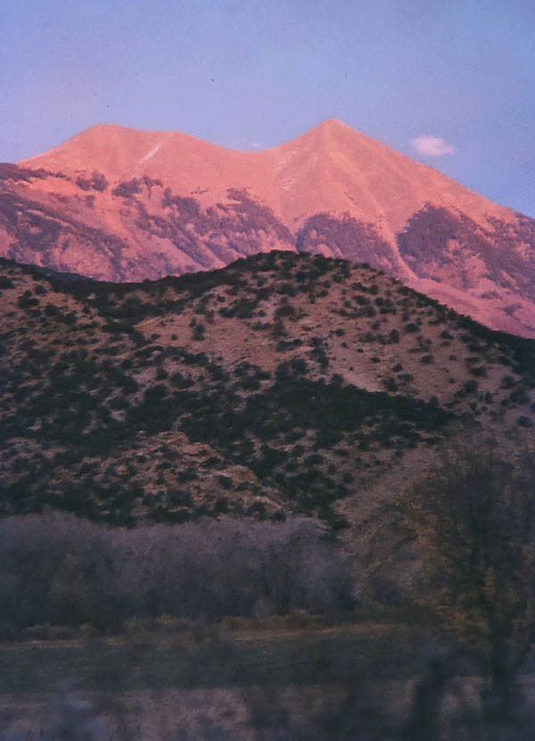 Alpenglow on Tukuhnikivatz, from Pack Creek Ranch. January 1973. Photo by Bill Benge